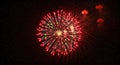 Vibrant Red and Green Fireworks Exploding in a Starry Night Sky Royalty Free Stock Photo