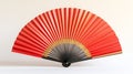 A vibrant red hand fan with gold accents Royalty Free Stock Photo
