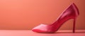 Stylish Red High Heeled Shoe on Pink Surface Royalty Free Stock Photo
