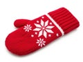 Vibrant red knitted mitten with white snowflake pattern Royalty Free Stock Photo