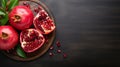 Vibrant Red Pomegranate On Dark Wooden Board - Stock Photo