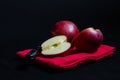 Vibrant red Royal Gala English apples on red tea towel