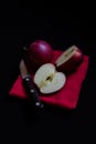 Vibrant red Royal Gala English apples on red tea towel Royalty Free Stock Photo