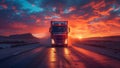 Red semi truck driving down road with sun setting in cloudy sky Royalty Free Stock Photo