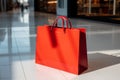 Vibrant red shopping bags placed neatly on the boutiques floor