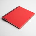Bright Red Spiral Bound Notebook on a White Background Royalty Free Stock Photo