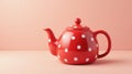 Vibrant red teapot with white polka dots on a solid background