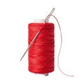 Vibrant red thread spool with sewing needle piercing the material isolated on white background Royalty Free Stock Photo