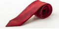 A vibrant red tie elegantly against a white background. Royalty Free Stock Photo