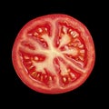 Vibrant Red Tomato Slice Exhibiting Fresh Texture and Seeds for Culinary Use Royalty Free Stock Photo