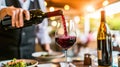 The vibrant red wine gracefully fills the glass, a visual representation of the indulgence and pleasure that lies within Royalty Free Stock Photo