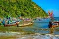 Vibrant Reflections: Traditional Fishing Boat at the Shores of Thailand