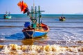 Vibrant Reflections: Traditional Fishing Boat at the Shores of Thailand
