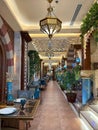 Vibrant restaurant in Doha, Qatar, with a long, illuminated walkway