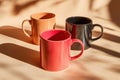 Vibrant retro comic style ceramic mugs in minimalistic light and shadow composition Royalty Free Stock Photo