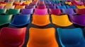 Vibrant rows of multicolored modern plastic chairs in auditorium setting Royalty Free Stock Photo