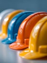 Vibrant safety helmets in a row showcasing essential protective gear for construction workers and industrial environments with Royalty Free Stock Photo