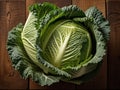 Vibrant Savoy Cabbage is Displayed on a Rustic Wooden Table.