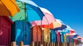Vibrant seaside boardwalk with colorful beach huts and sun umbrellas, perfect for summer promotion.