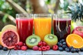 Assorted Fresh Fruit Juices Served With Citrus Slices and Berries on a Dark Surface