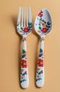vibrant set of modern flatware, featuring a dinner fork and a table spoon, set vertically against a apricot background. spoon and Royalty Free Stock Photo