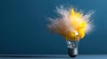 Colorful smoke exploding from a light bulb creating a vibrant and dynamic visual on a blue background Royalty Free Stock Photo