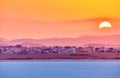 Vibrant and soften view of nice sunset over dry salt lake in Cyprus Larnaca in summer Royalty Free Stock Photo