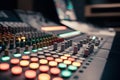 Vibrant sound mixing console with colorful buttons and knobs in dim lighting Royalty Free Stock Photo