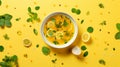 Vibrant Soup Flatlay On Yellow Background With Lemon Slices