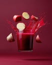 A vibrant splash of red juice surrounded by fresh ingredients, showcasing a dynamic drink concept Royalty Free Stock Photo