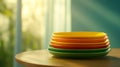 Vibrant stack of colorful ceramic plates, kitchenware, tableware, and dining essentials for a stylish table setting Royalty Free Stock Photo