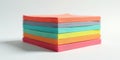 A vibrant stack of colorful paper sheets for artistic creations and note-taking. Generative AI Royalty Free Stock Photo