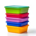 Stack of colorful plastic food storage containers with lids isolated on white background Royalty Free Stock Photo