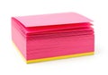 Stack of bright pink sticky notes with a yellow base isolated on white background Royalty Free Stock Photo