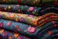 A vibrant stack of quilts featuring intricate floral designs Royalty Free Stock Photo