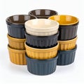 Stacked ramekins create a visually appealing pattern of color and shape on white background Royalty Free Stock Photo