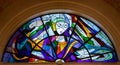 Vibrant stained glass window inside the basilica of Fatima, Portugal.