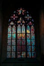 A vibrant stained glass window in St. Vitus Cathedral in Prague