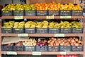 Vibrant Street Market: Colorful display of bananas, onions, potatoes, lemons and oranges at a fruit stall. Royalty Free Stock Photo