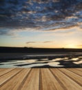 Vibrant sunrise landscape reflected in low tide water on beach w Royalty Free Stock Photo