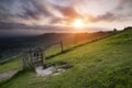 Vibrant sunrise over countryside landscape