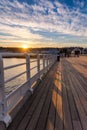 Vibrant sunset casting golden light over Beaumaris Pier in North Wales Royalty Free Stock Photo