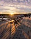 Vibrant sunset casting golden light over Beaumaris Pier in North Wales Royalty Free Stock Photo