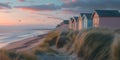 Vibrant Sunset: Colorful Beach Huts Along Shoreline Royalty Free Stock Photo