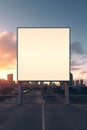 Vibrant sunset forming a fiery backdrop for a blank billboard frame, perfect for bold advertising