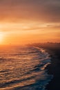 Vibrant sunset over the beach from the Balboa Pier, in Newport Beach, Orange County, California Royalty Free Stock Photo