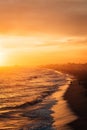 Vibrant sunset over the beach from the Balboa Pier, in Newport Beach, Orange County, California Royalty Free Stock Photo