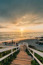 Vibrant sunset over a staircase and the Pacific Ocean at Windansea Beach, in La Jolla, San Diego, California Royalty Free Stock Photo