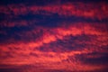 Vibrant sunset sky with dramatic clouds showcasing shades of red, orange, and purple, creating a stunning natural canvas for Royalty Free Stock Photo