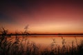 Vibrant sunset sky over Tuggerah Lake from Canton Beach in Toukley, NSW Australia Royalty Free Stock Photo